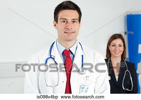 Stock Photography - Portrait of male and female doctors. Fotosearch