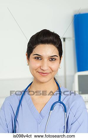 Stock Photograph - Portrait of mid adult female doctor. Fotosearch