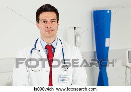 Portrait of mid adult male doctor View Large Photo Image Stock Image - Portrait of mid adult male doctor. Fotosearch