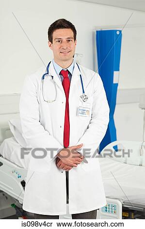 Portrait of mid adult male doctor View Large Photo Image Stock Photography - Portrait of mid adult male doctor. Fotosearch
