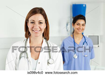 Portrait of two female doctors View Large Photo Image Stock Image - Portrait of two female doctors. Fotosearch