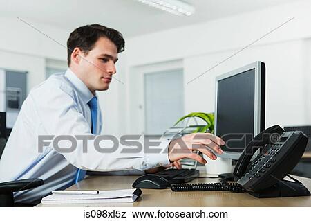 Office worker answering telephone View Large Photo Image Stock Photo - Office worker answering telephone. Fotosearch