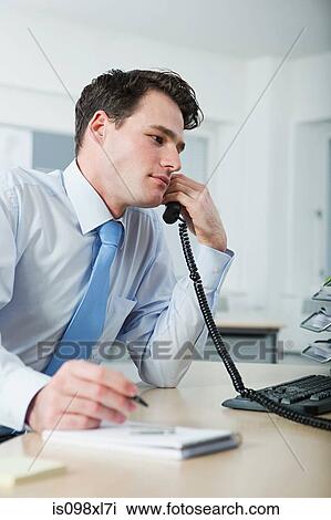 Office worker on telephone call View Large Photo Image Stock Image - Office worker on telephone call. Fotosearch