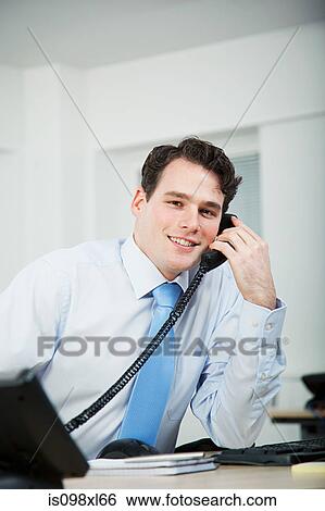 Office worker on telephone call View Large Photo Image Stock Photograph - Office worker on telephone call. Fotosearch