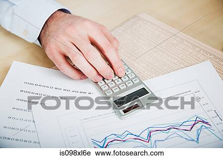 Office worker using calculator View Large Photo Image Stock Image - Office worker using calculator. Fotosearch