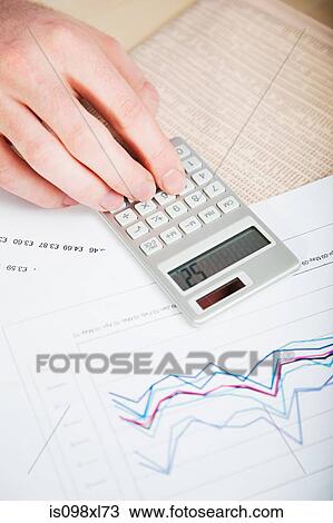 Office worker using calculator View Large Photo Image Stock Image - Office worker using calculator. Fotosearch