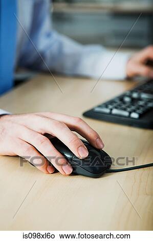 Office worker using computer View Large Photo Image Picture - Office worker using computer. Fotosearch