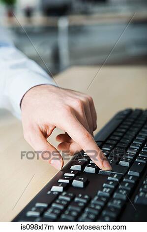 Picture - Office worker using computer. Fotosearch