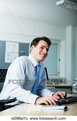 Office worker using computer View Large Photo Image Picture - Office worker using computer. Fotosearch