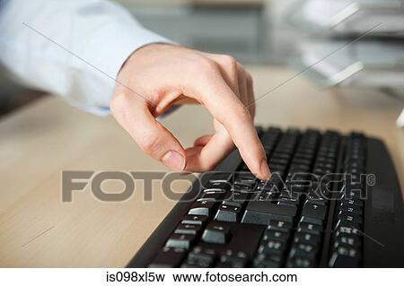 Office worker using computer View Large Photo Image Stock Photo - Office worker using computer. Fotosearch