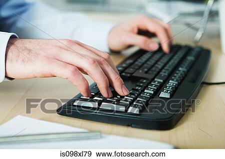 Office worker using computer View Large Photo Image Stock Photo - Office worker using computer. Fotosearch