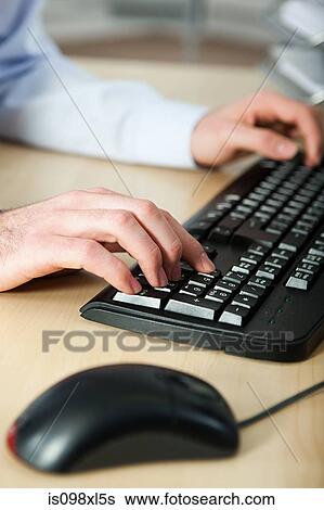 Office worker using computer View Large Photo Image Stock Photograph - Office worker using computer. Fotosearch