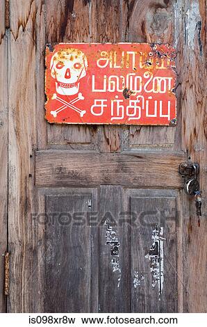 Indian warning sign on wooden door, Tamil Nadu View Large Photo Image Stock Photo - Indian warning sign on wooden door, Tamil Nadu. Fotosearch