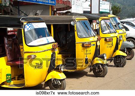 Yellow auto rickshaws lined up in Ooty, Nilgiri Hills, Kerala View Large Photo Image Stock Photo - Yellow auto rickshaws lined up in Ooty, Nilgiri Hills, Kerala. Fotosearch