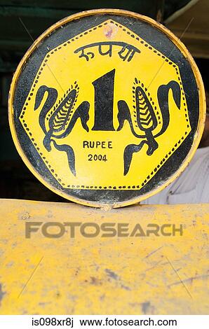 Yellow tin rupee sign for public telephone View Large Photo Image Stock Image - Yellow tin rupee sign for public telephone. Fotosearch