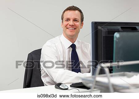 Stock Image - Businessman in office. Fotosearch