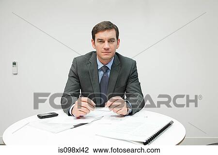 Businessman in office View Large Photo Image Stock Image - Businessman in office. Fotosearch