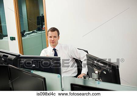 Stock Image - Businessman in office. Fotosearch