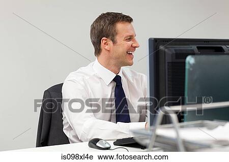 Businessman in office View Large Photo Image Stock Image - Businessman in office. Fotosearch