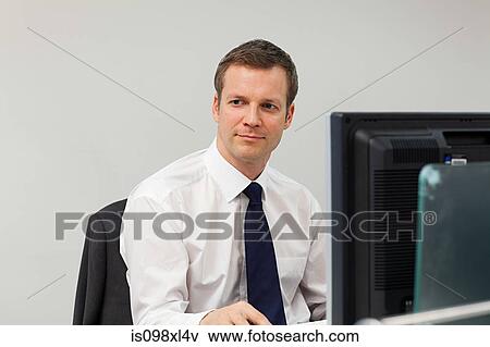 Businessman in office View Large Photo Image Stock Photo - Businessman in office. Fotosearch