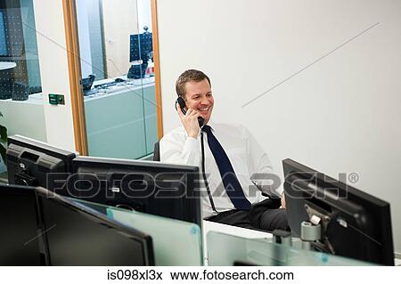 Businessman on the phone View Large Photo Image Stock Photo - Businessman on the phone. Fotosearch