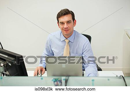 Stock Image - Businessman using computer. Fotosearch