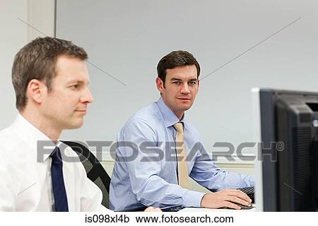 Stock Image - Businessmen in office. Fotosearch
