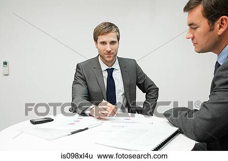 Businessmen in office View Large Photo Image Stock Photograph - Businessmen in office. Fotosearch