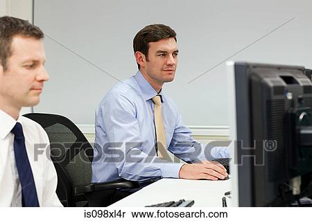 Stock Photography - Businessmen using computers. Fotosearch