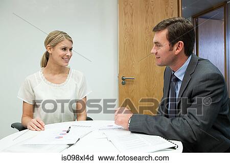 Stock Image - Businesspeople having duscussion. Fotosearch
