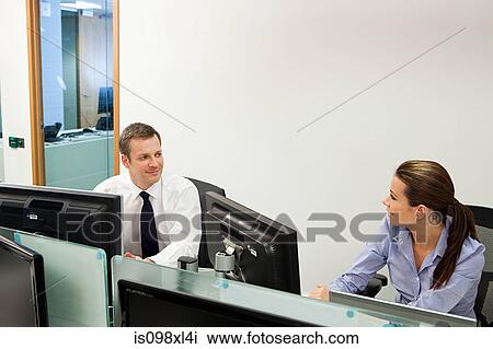 Businesspeople in office View Large Photo Image Stock Image - Businesspeople in office. Fotosearch