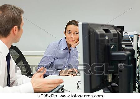 Businesswoman ignoring male colleague in office View Large Photo Image Stock Photography - Businesswoman ignoring male colleague in office. Fotosearch