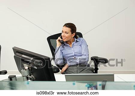 Stock Photography - Businesswoman on the phone. Fotosearch