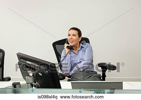 Stock Photography - Businesswoman on the phone. Fotosearch