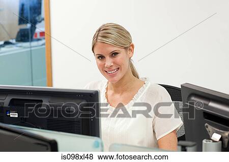 Businesswoman using computer View Large Photo Image Stock Photo - Businesswoman using computer. Fotosearch