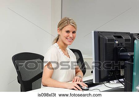 Stock Photograph - Businesswoman using computer. Fotosearch