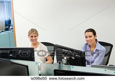 Stock Image - Businesswomen in office. Fotosearch