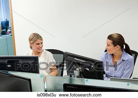 Stock Photograph - Businesswomen in office. Fotosearch