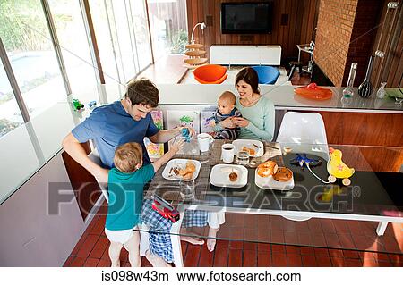 Picture - Family eating breakfast. Fotosearch