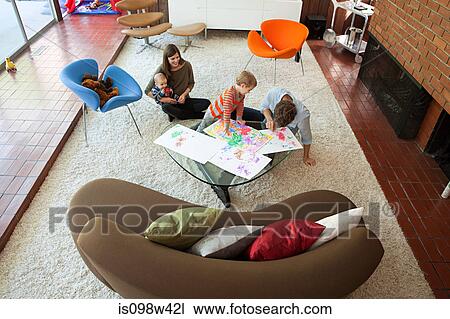 Family playing in living room View Large Photo Image Stock Image - Family playing in living room. Fotosearch