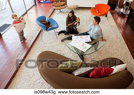 Family playing in living room View Large Photo Image Stock Image - Family playing in living room. Fotosearch
