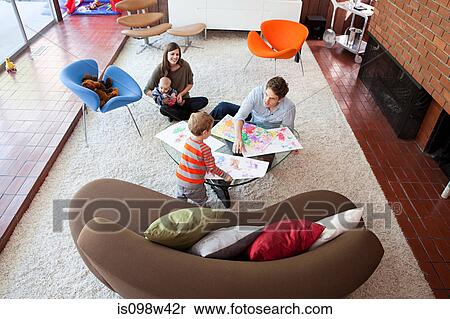 Family playing in living room View Large Photo Image Stock Photography - Family playing in living room. Fotosearch