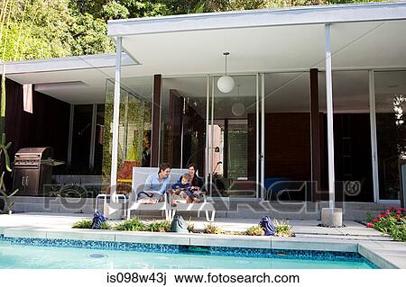 Parents with son at poolside View Large Photo Image Stock Image - Parents with son at poolside. Fotosearch