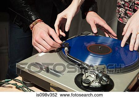 Disc jockey at party on mixing desk View Large Photo Image Stock Image - Disc jockey at party on mixing desk. Fotosearch
