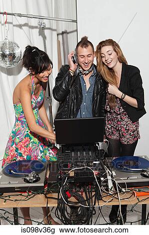 Disc jockey at party on mixing desk View Large Photo Image Stock Image - Disc jockey at party on mixing desk. Fotosearch