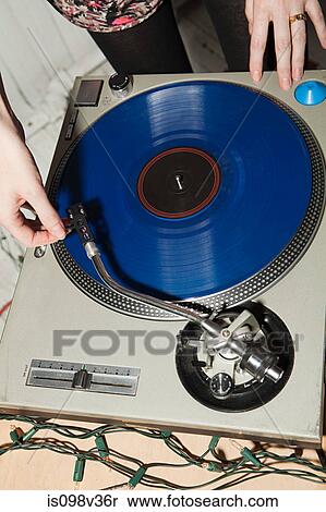Stock Photography - Disc jockey at party on mixing desk. Fotosearch