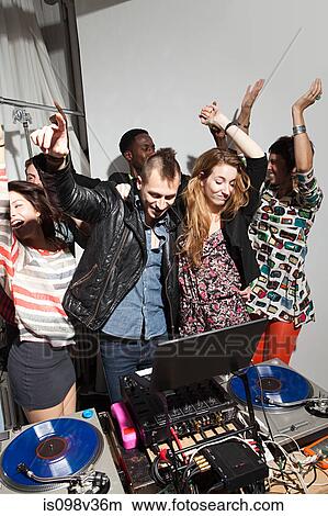 Disc jockeys dancing at party View Large Photo Image Picture - Disc jockeys dancing at party. Fotosearch