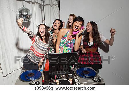 Disc jockeys dancing at party View Large Photo Image Stock Photography - Disc jockeys dancing at party. Fotosearch