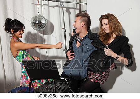 Disc jockeys play fighting at party View Large Photo Image Stock Image - Disc jockeys play fighting at party. Fotosearch