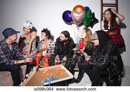 Picture - Group of people sitting at party. Fotosearch